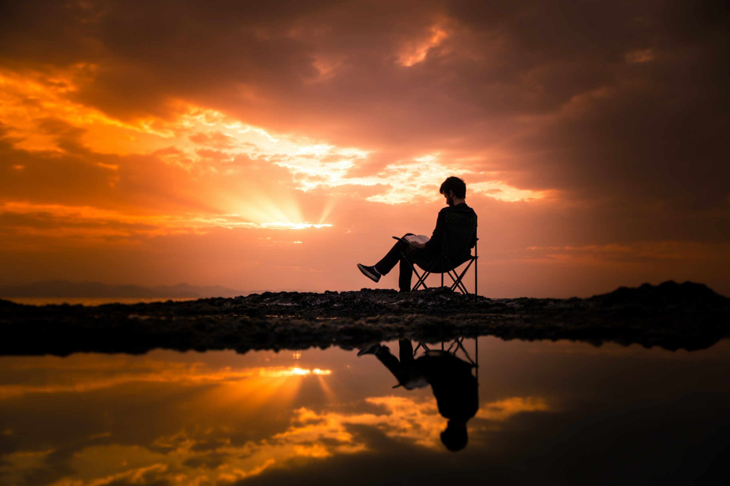Man on the beach at sunset