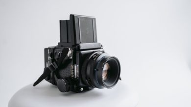 a medium format film camera on a white surface